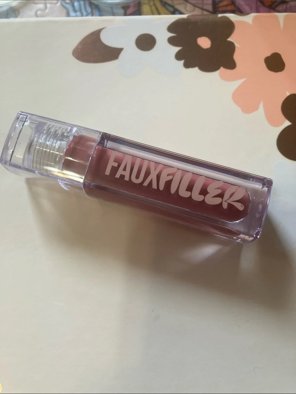 HUDA “Bombshell” FauxFiller Lip Gloss
